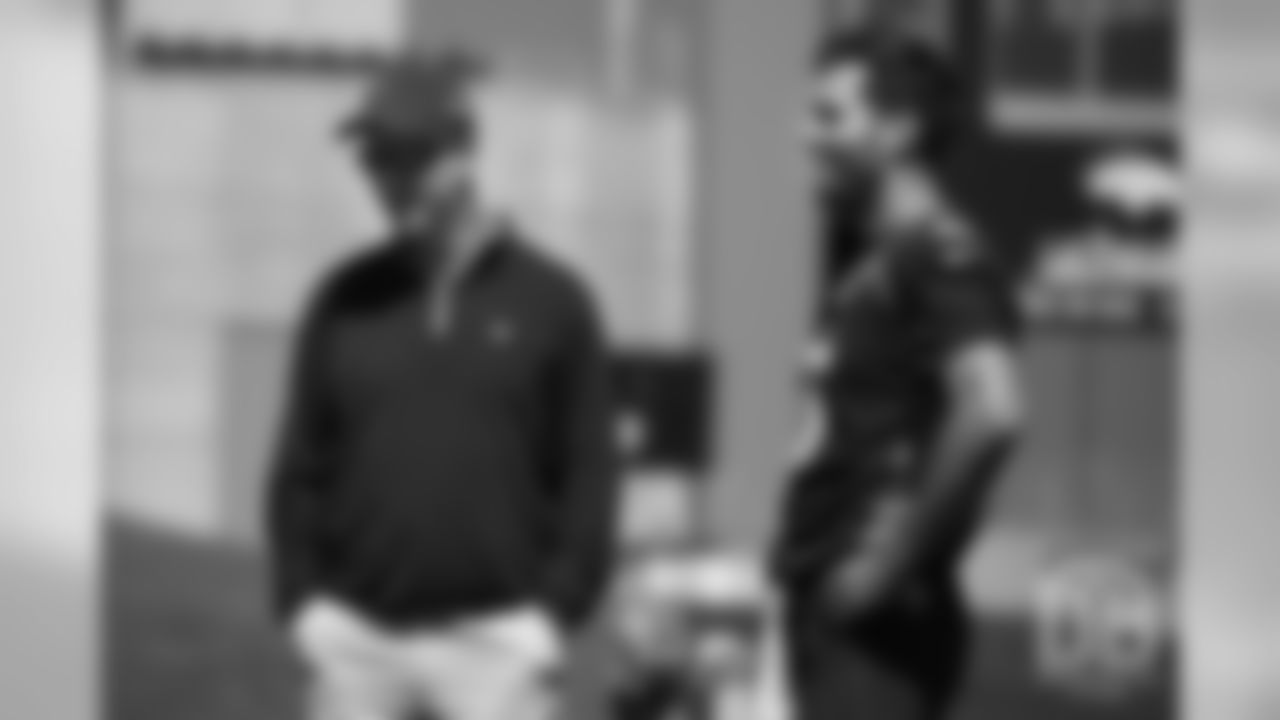 Joe Flacco talks with former Broncos quarterback Peyton Manning during the Broncos' practice on the eight day of their OTAs on May 30, 2019.