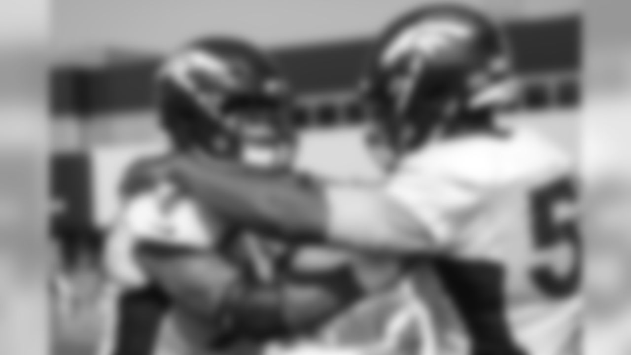 Defensive end Derek Wolfe (95) and defensive end DeMarcus Walker (57) during a practice at UCHealth Training Center on Aug. 13, 2018.