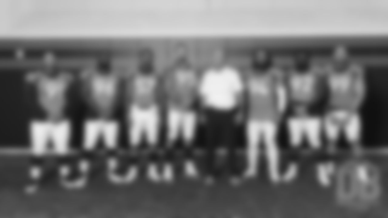 Niles Scott, Shelby Harris, DeMarcus Walker, Derek Wolfe, Defensive Line Coach Bill Kollar, Domata Peko Sr., Zach Kerr and Adam Gotsis at team photo day at UCHealth Training Center on September 15, 2018.