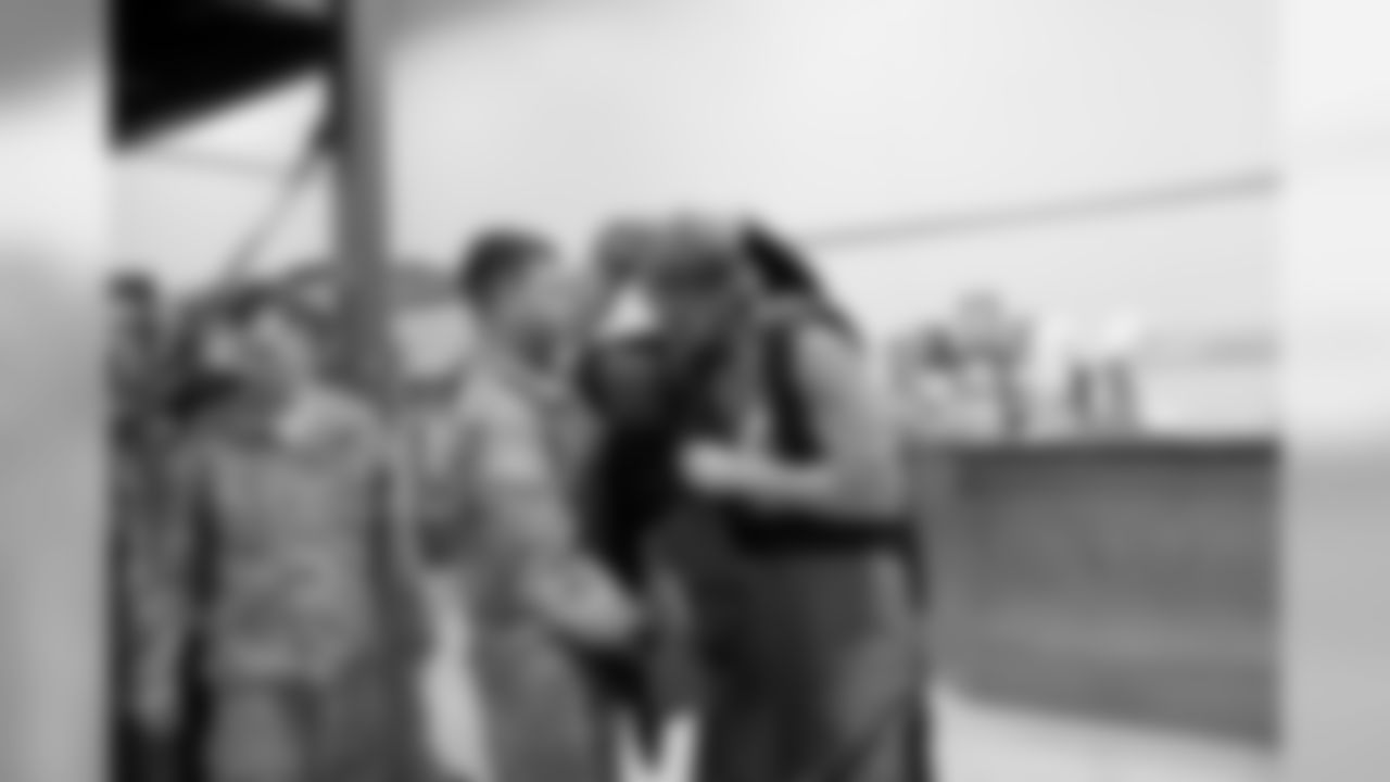 Aaron Brewer tries on a bomb suit with the 71st EOD (Explosive Ordinance Disposal) Company.