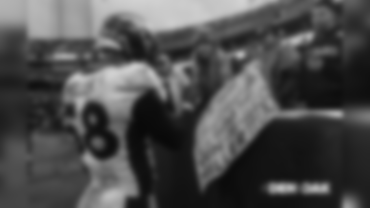 Von Miller grants a fan's Christmas wish and gives her a football pregame before the Broncos' Week 16 game against the Oakland Raiders on December 24, 2018.
