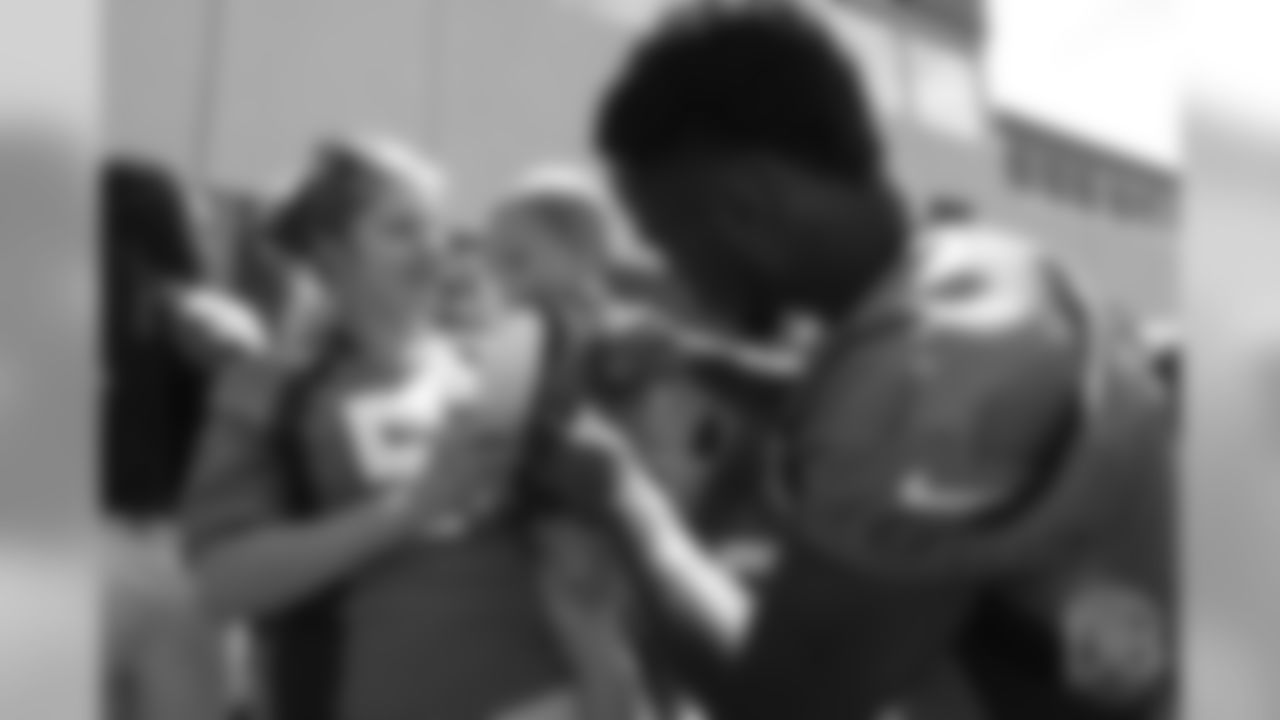 wide receiver Isaiah McKenzie (16) meets patients from Children's Hospital Colorado's burn unit after the final day of OTAs on June 7, 2018 at UCHealth Training Center.