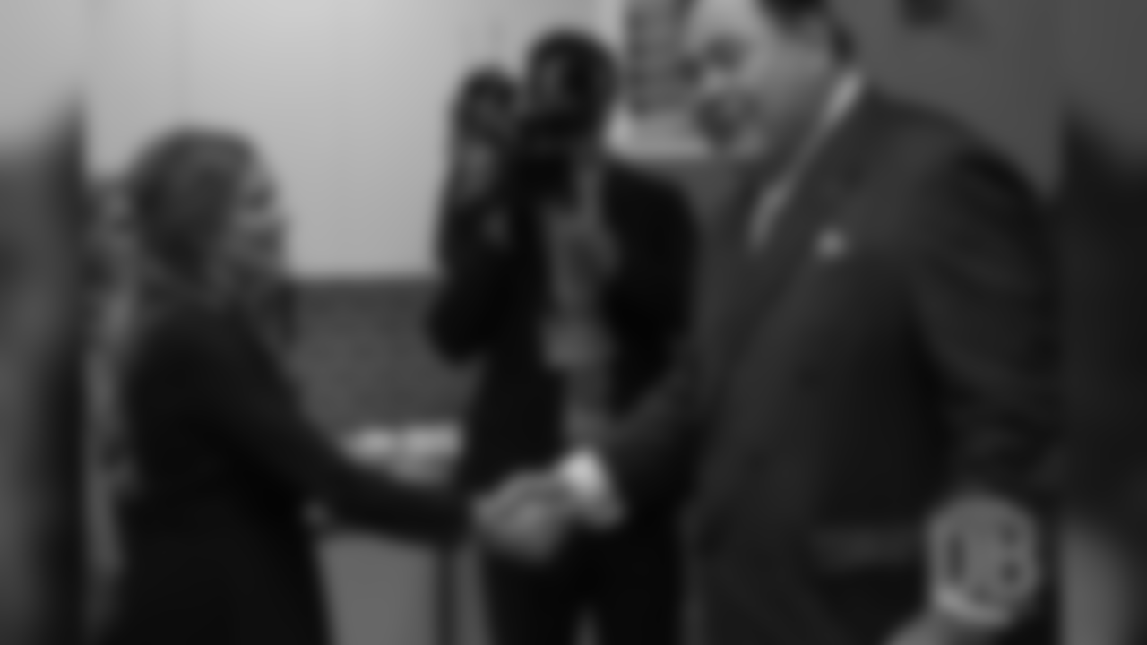 Brittany Bowlen shakes hands with David Baker after he gave the news that Pat Bowlen was elected for enshrinement in the Pro Football Hall of Fame's Class of 2019 on February 2, 2019.