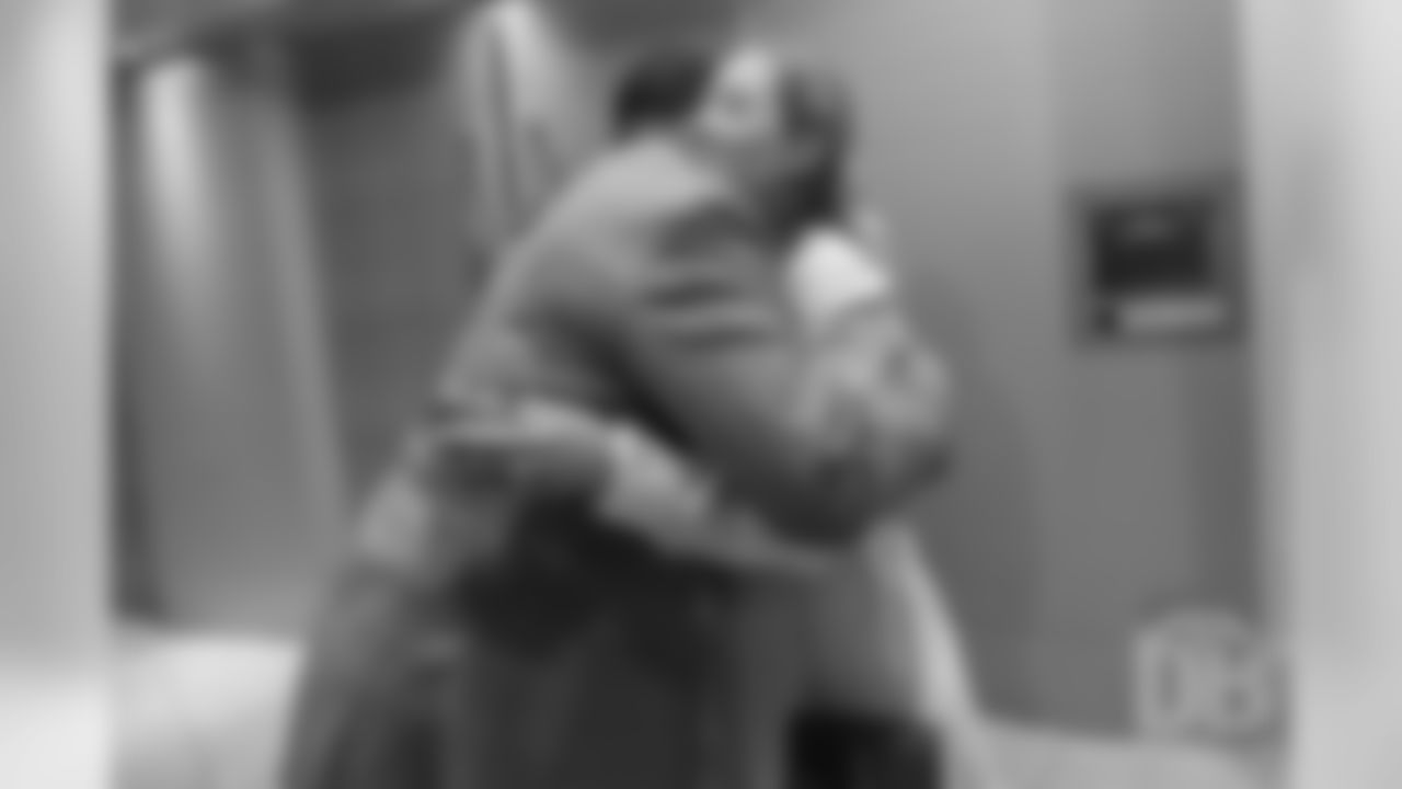 Steve Atwater hugs Brittany Bowlen at the Pro Football Hall of Fame's Merlin Olsen Luncheon in Atlanta on February 1, 2019.