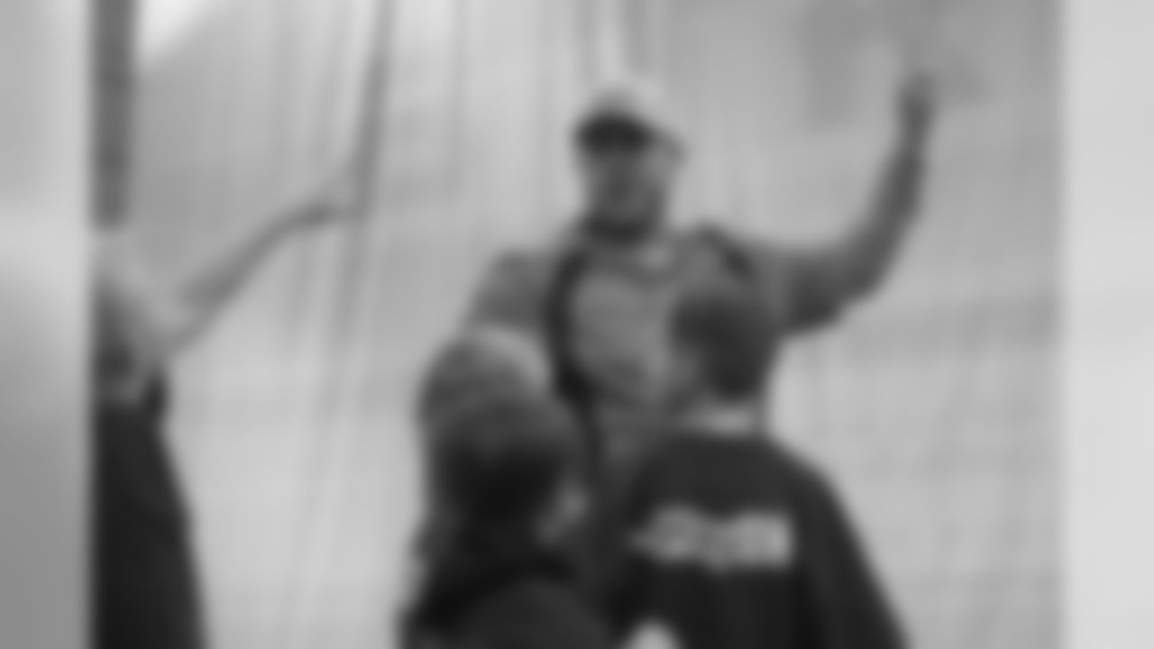 Case Keenum explains how to kick a field goal during a Salute to Service-themed PLAY 60 clinic for children from military families in the Pat Bowlen Fieldhouse at UCHealth Training Center on November 13, 2018.