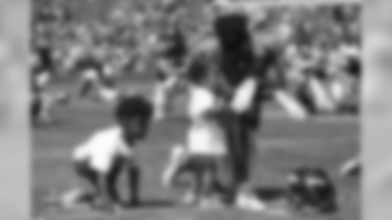 Wide receiver Emmanuel Sanders (10) with his two children, Princeton and Zoie, after the seventh day of training camp on August 4, 2018, at UCHealth Training Center.