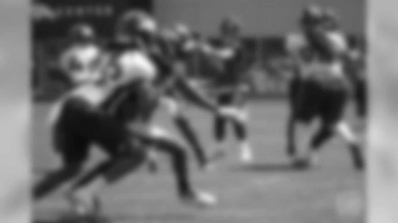 quarterback Case Keenum (4) looks to throw to wide receiver Emmanuel Sanders (10) at the ninth day of OTAs on June 6, 2018 at UCHealth Training Center.