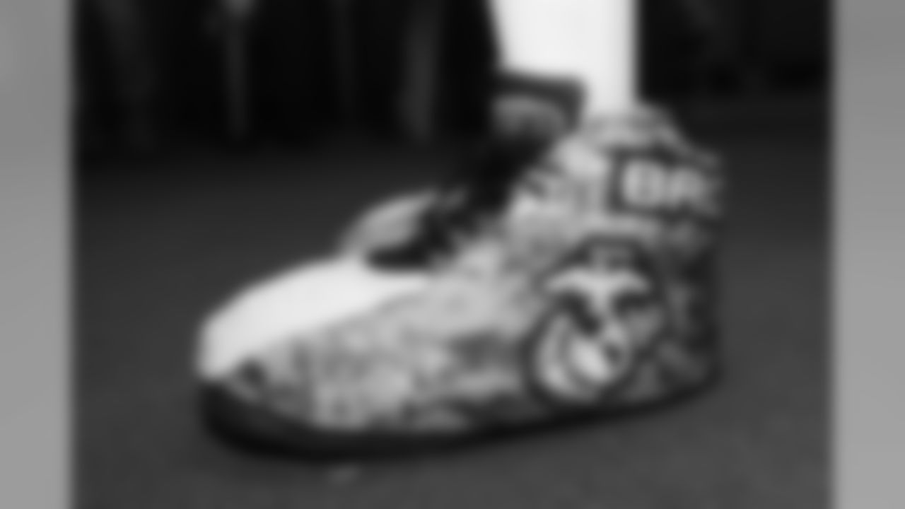 A close-up look at Miles the mascot's custom Salute to Service shoes.