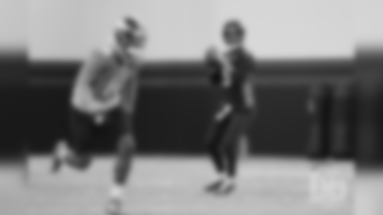 Joe Flacco drops back to pass to Courtland Sutton during the third and final day of voluntary veteran minicamp on April 18, 2019.