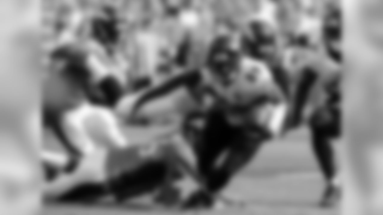 Ravens WR Steve Smith Sr. returns a punt as LS Aaron Brewer and OLB Shaquil Barrett try to make a tackle
