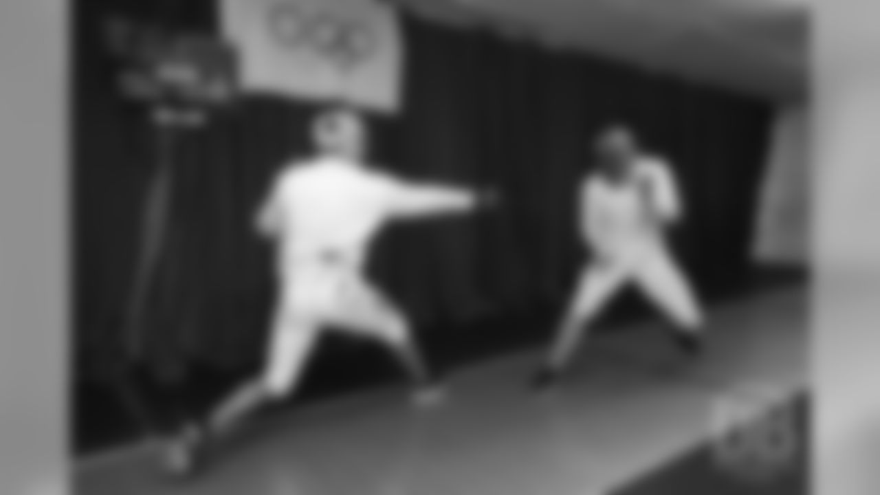Brandon McManus and Casey Kreiter try their hands at fencing at the Denver Fencing Center on July 17, 2018.