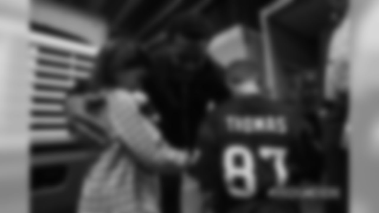Demaryius Thomas meets with Peyton Manning's children, Marshall and Mosley, after the Broncos' Week 9 game against the Houston Texans at Broncos Stadium at Mile High on November 4, 2018.