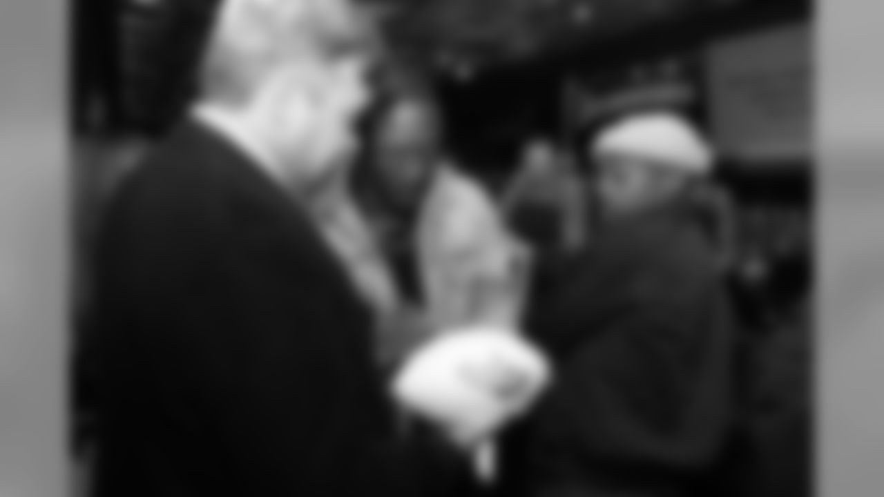 Will Parks signs a football during Von's Vision at Mile High Station in Denver on November 5, 2018.