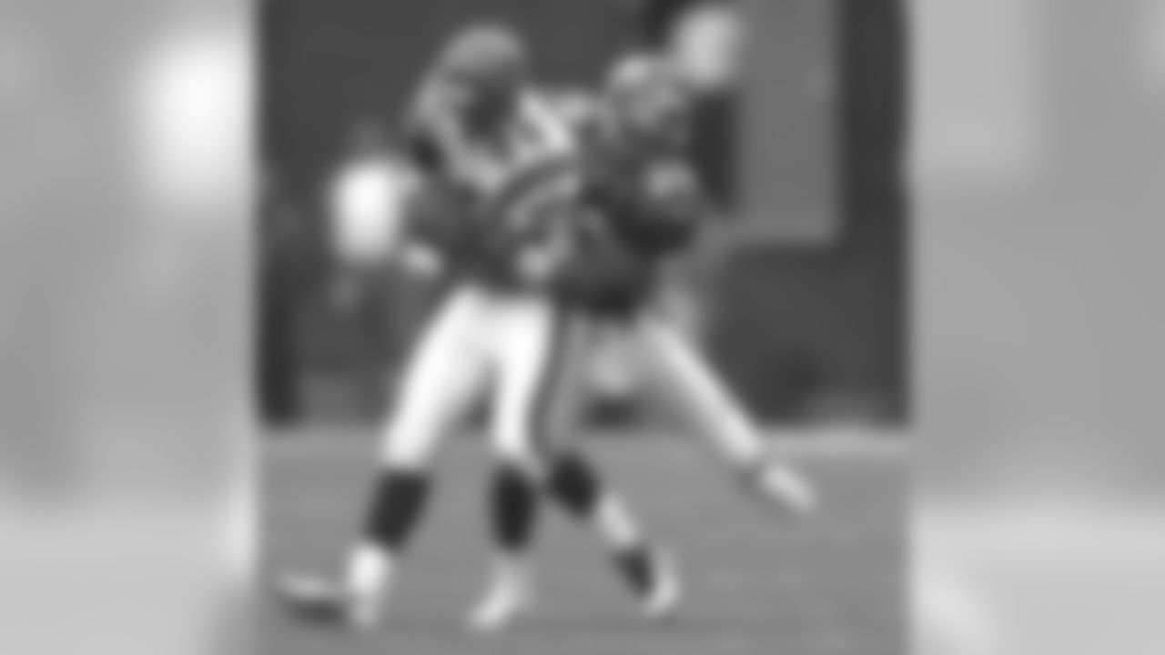 Denver: Ray Crockett makes a tackle against the Cincinnati Bengals at Mile High Stadium in Denver, CO on September 21, 1997.