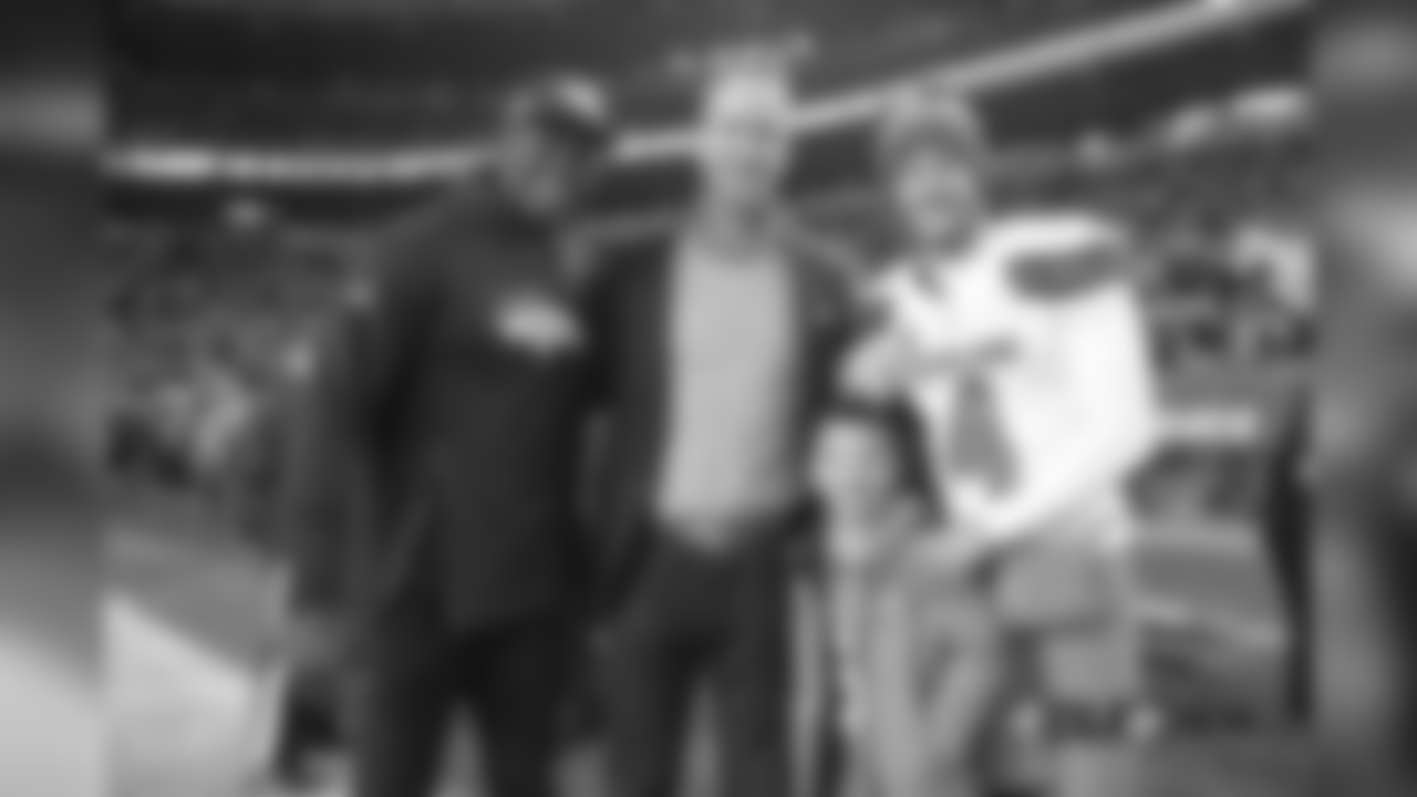 Pass Rush Consultant (and former outside linebacker) DeMarcus Ware, Peyton Manning, Manning's son Marshall, and Britton Colquitt before the Broncos' Week 15 game against the Cleveland Browns at Broncos Stadium at Mile High on December 15, 2018.