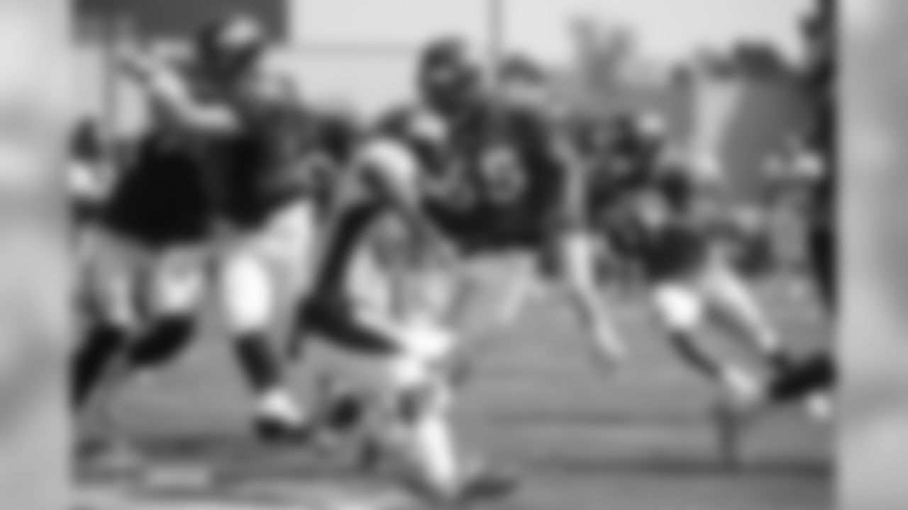Guard Ron Leary (65) prepares to block for running back Royce Freeman (37) during the ninth day of training camp on August 7, 2018, at UCHealth Training Center.