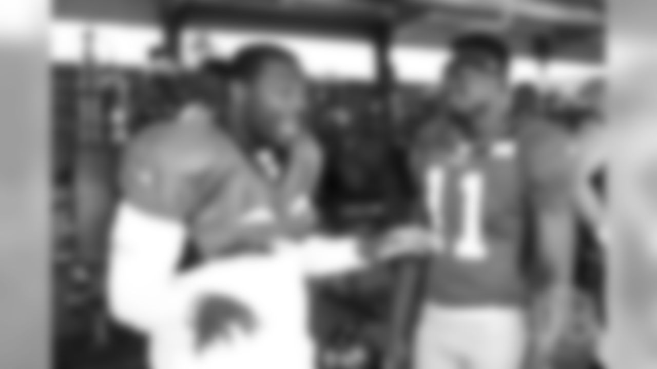 Broncos RB C.J. Anderson with 49ers WR Marquise Goodman