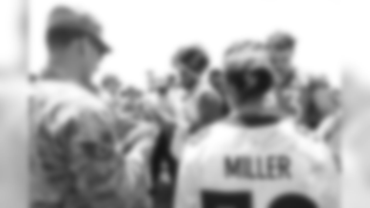 Nose tackle Kyle Peko (90) and tight end Matt LaCosse (83) meet military members of the Colorado Air National Guard and the U.S. Army after practice on June 12, 2018. The meet-and-greet was part of an event hosting servicemen and servicewomen with USAA and the Broncos Womens Organization.
