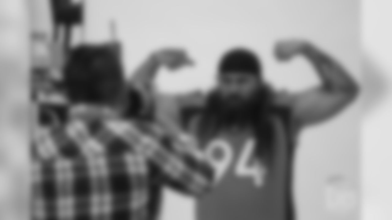 Nose tackle Domata Peko Sr. (94) poses for photos during the media sessions with team photographer Gabriel Christus on June 12, 2018.