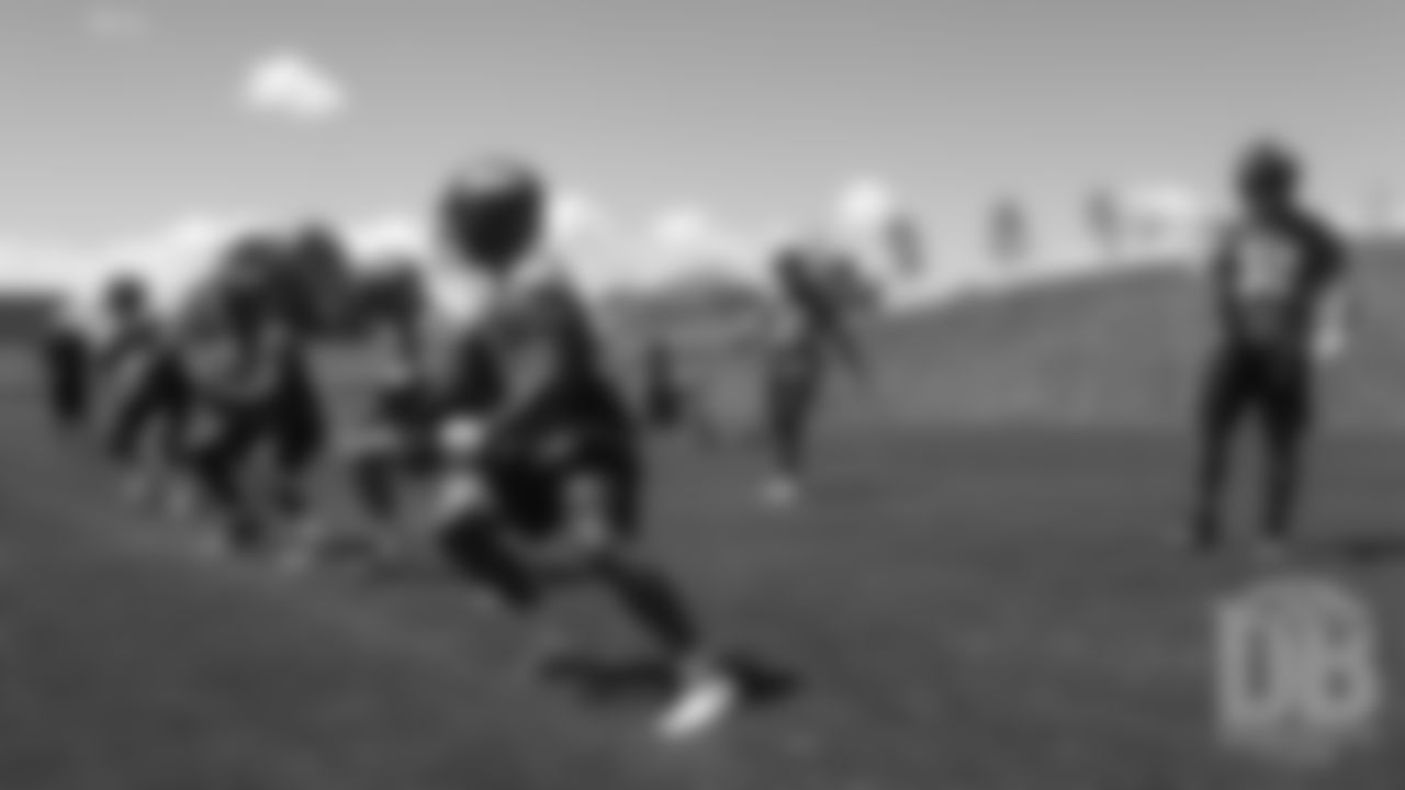 Khalfani Muhammad and the rest of the running backs during the Broncos' practice on the ninth day of their OTAs on May 31, 2019.