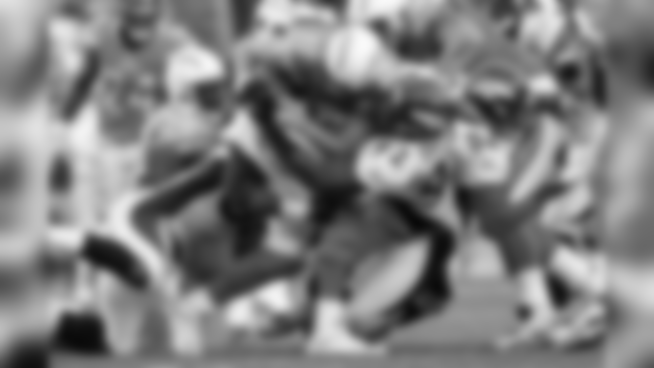 Denver Broncos Von Miller and Elvis Dumervil sack Chargers QB Philip Rivers on Nov. 27, 2011.