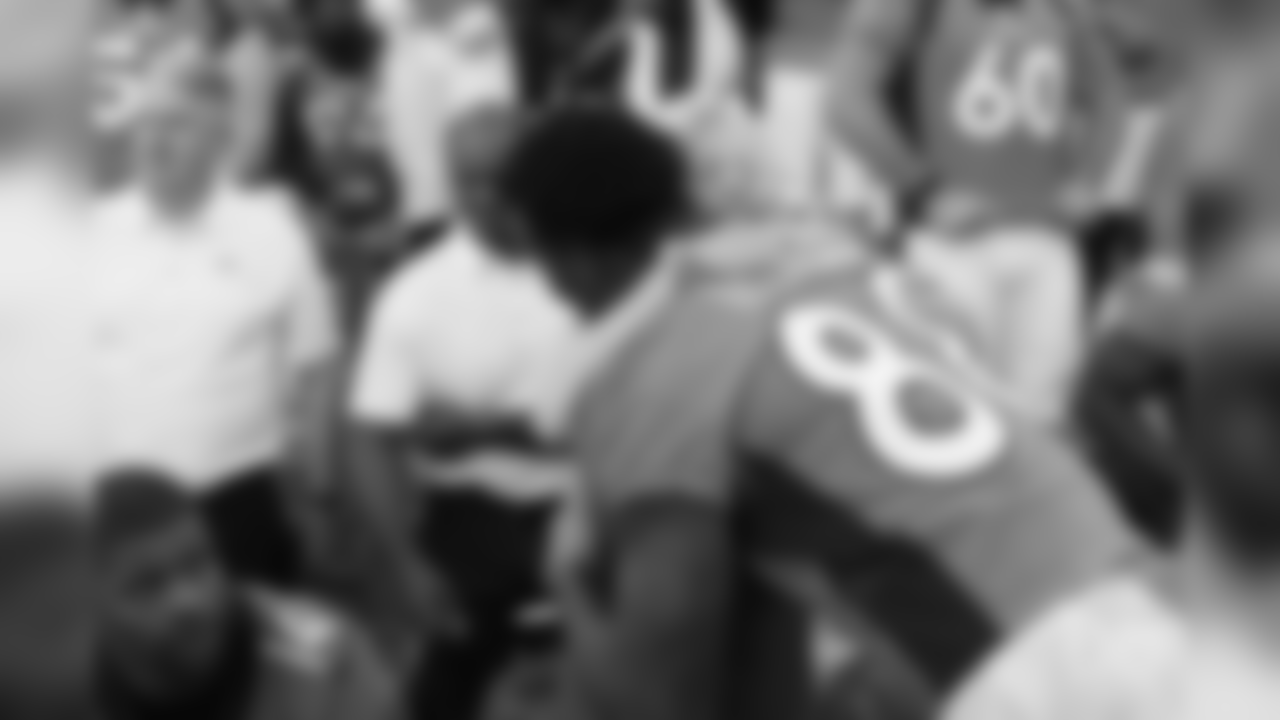 Annabel Bowlen, representing Broncos Owner Pat Bowlen, hugs Denver Broncos wide receiver Demaryius Thomas (88) before the team photo on Oct. 4, 2017.