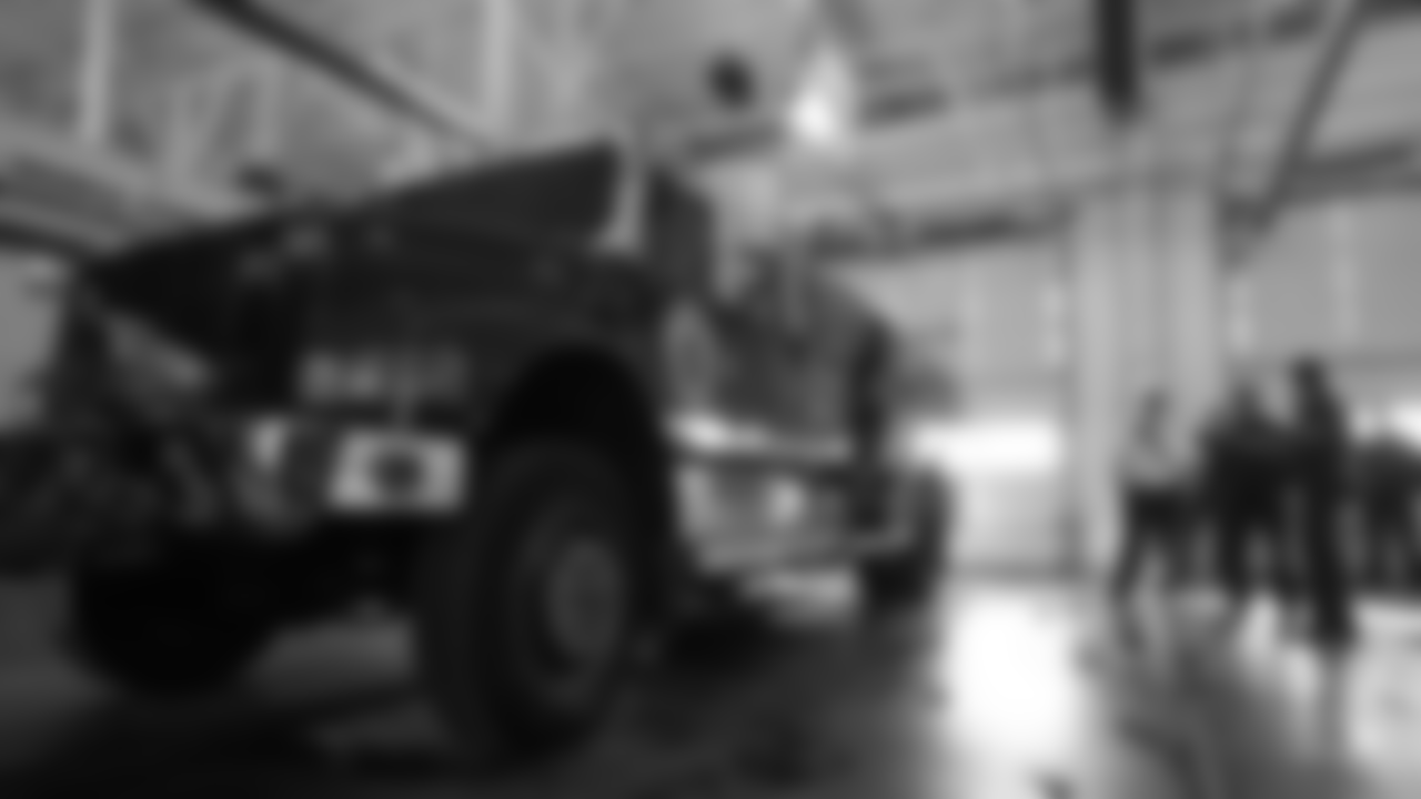 Head Coach Vic Fangio gets a tour of Aurora Fire Station 13 and its vehicles during a visit for Random Acts of Kindness Week on February 20, 2019.