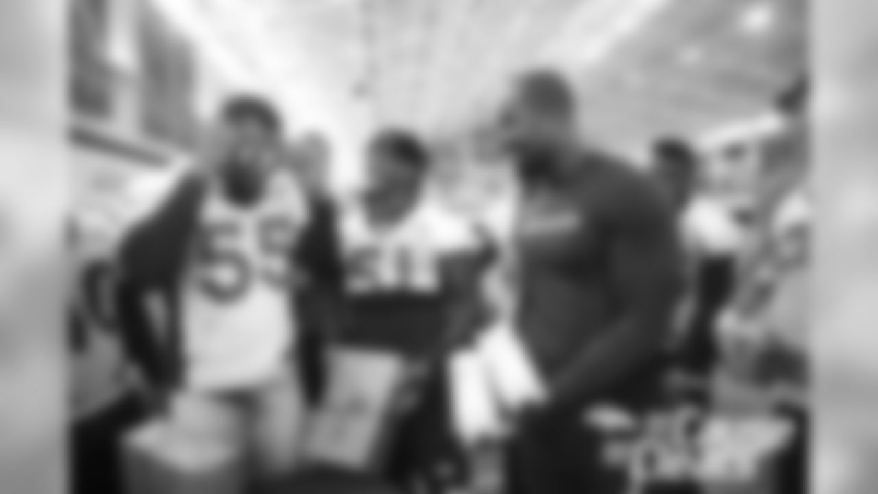 Von Miller shows off his custom cleats during the 2018 My Cause My Cleats unveiling for the players.
