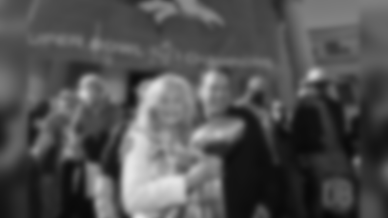 Annabel Bowlen and head coach Gary Kubiak pose for a photo with the Lombardi Trophy during the Broncos' Super Bowl 50 parade and celebration.