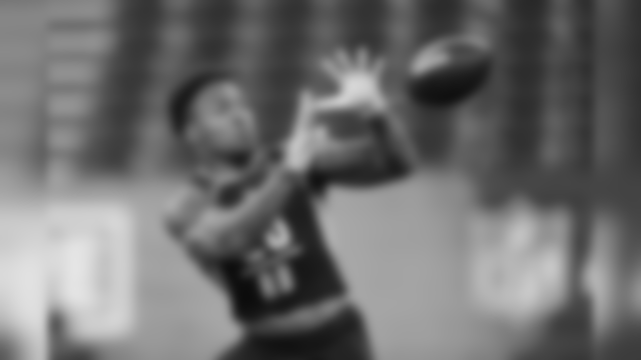 Texas A&M running back Trayveon Williams runs a drill at the NFL football scouting combine in Indianapolis, Friday, March 1, 2019. (AP Photo/Michael Conroy)