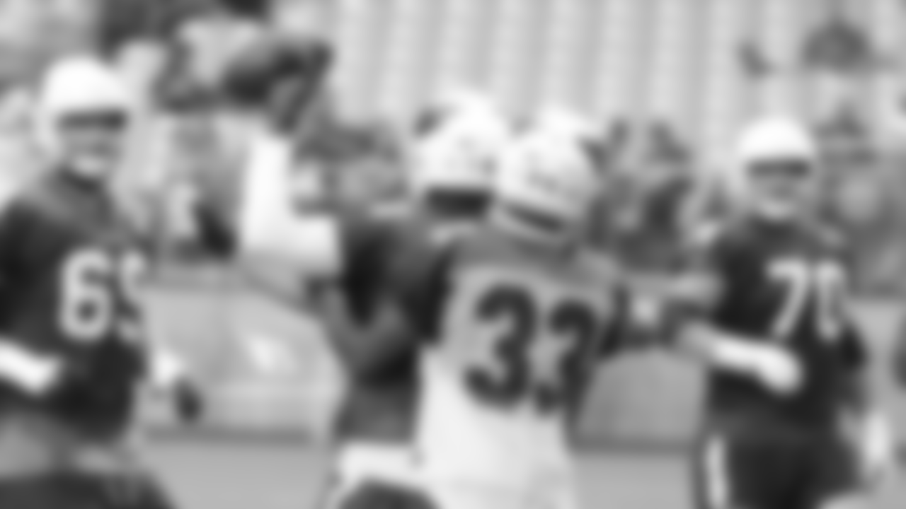 WR Greg Little holds the ball away from CB Christian Campbell