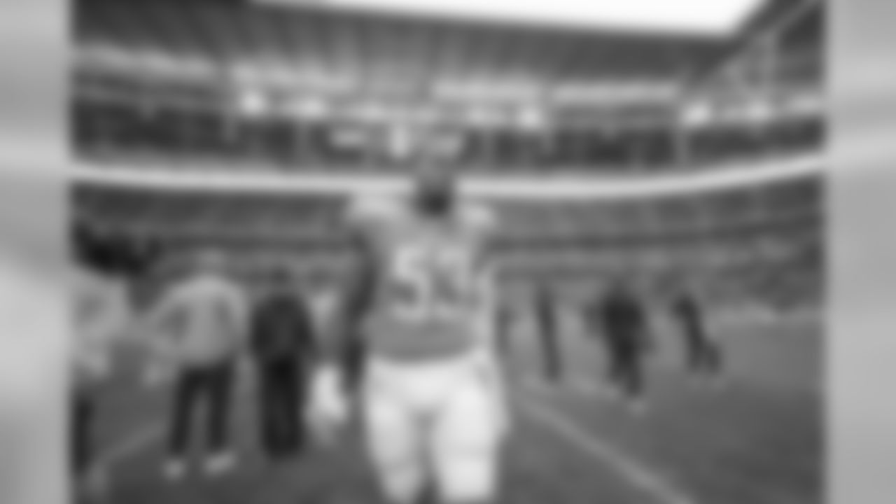 Mike Pouncey on the field at Wembley Stadium in London before the Week 7 matchup against the Tennessee Titans.