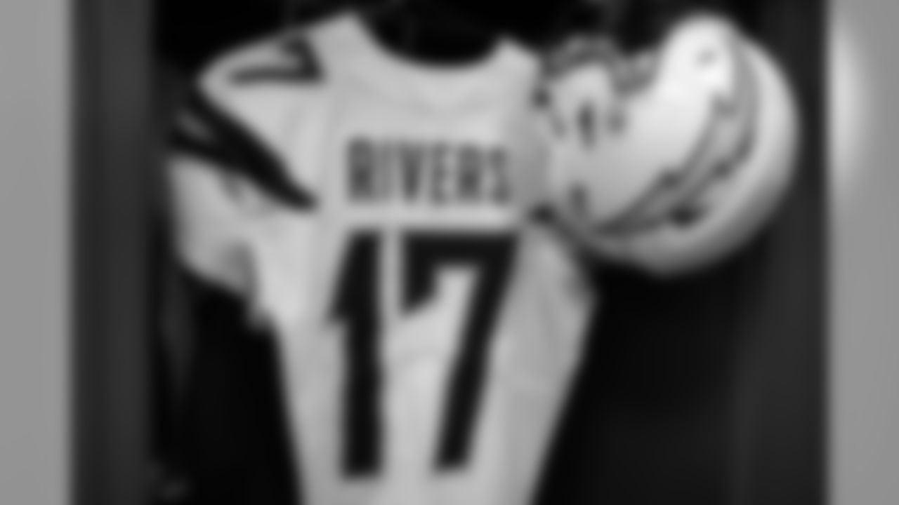 Philip Rivers' jersey and helmet hang in the locker room before the Wild Card matchup against the Baltimore Ravens at M&T Bank Stadium.