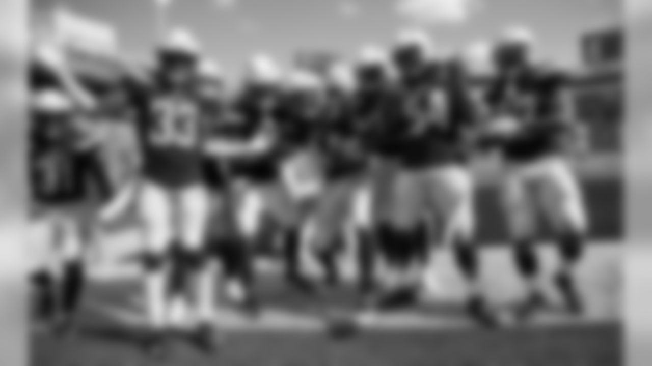 The Bolts celebrate Kyzir White's first NFL interception during the Chargers' Week 2 game against the Buffalo Bills at New Era Field.