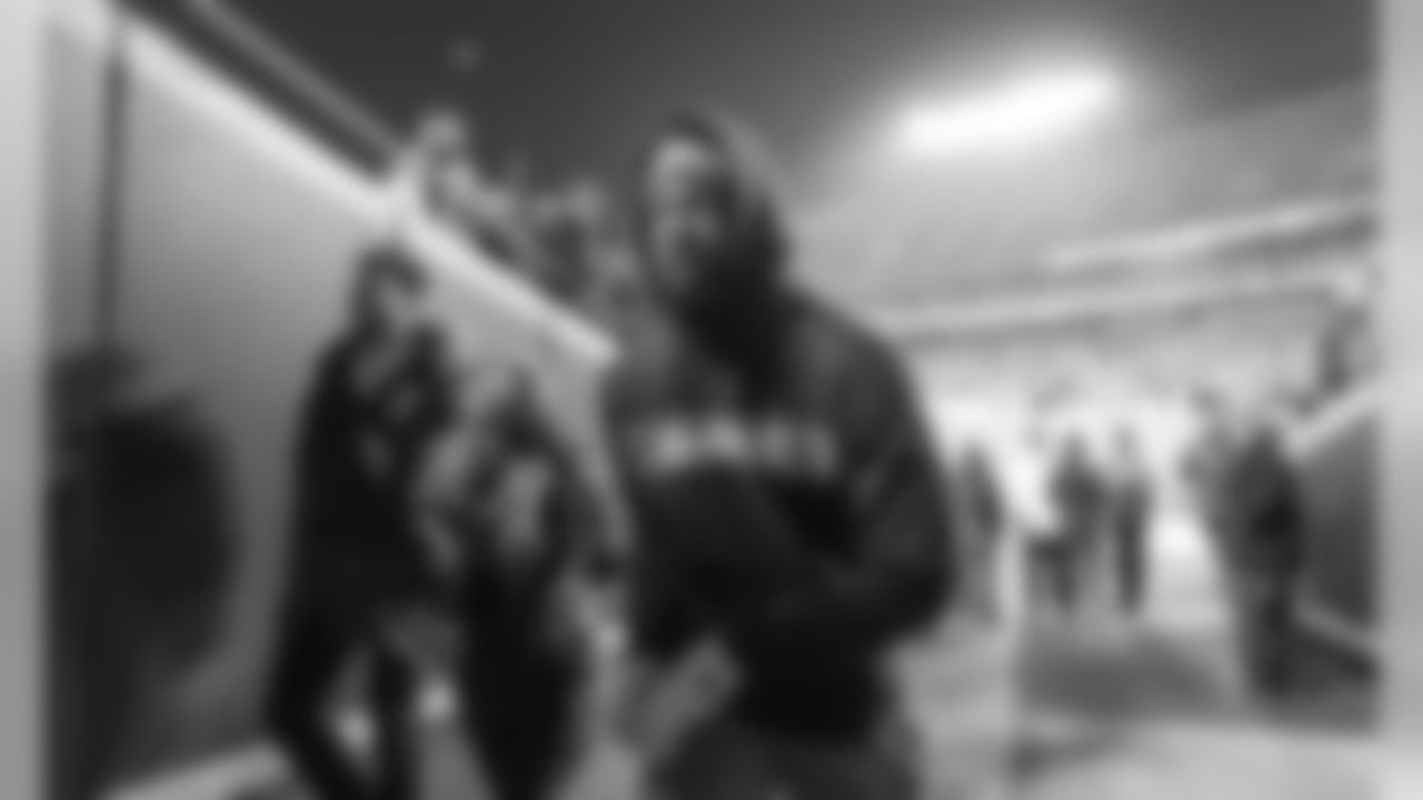 Mike Williams walks back to the locker room after warming up at Arrowhead Stadium before the Thursday night matchup against the Kansas City Chiefs.