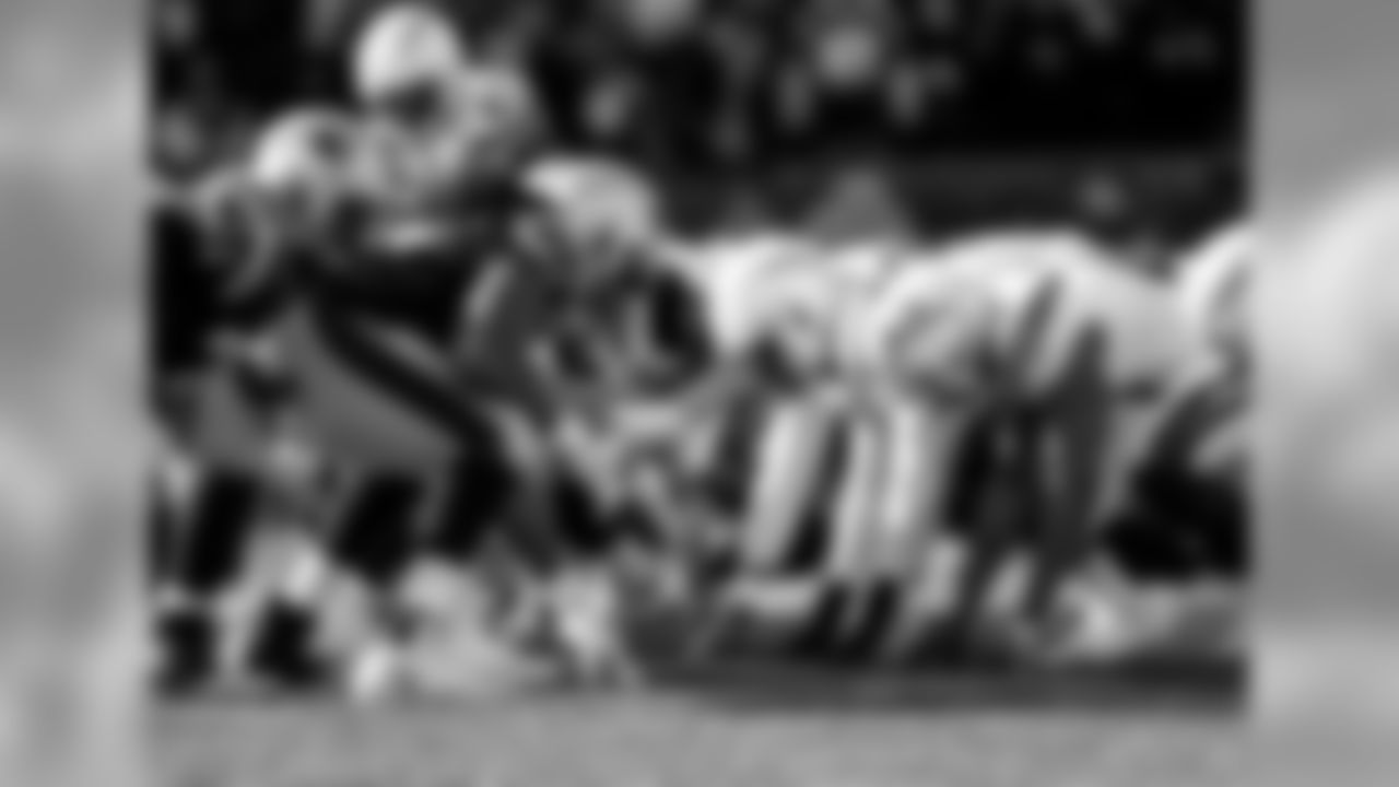 The Bolts line up before the snap during the Divisional Round matchup against the New England Patriots at Gillette Stadium.