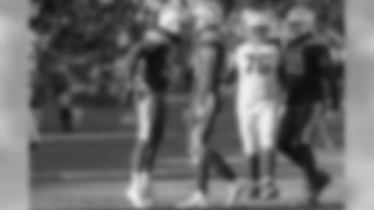 Melvin Ingram and Joey Bosa celebrate Bosa's second sack of the day during the Week 12 matchup against the Arizona Cardinals at ROKiT Field at StubHub Center.