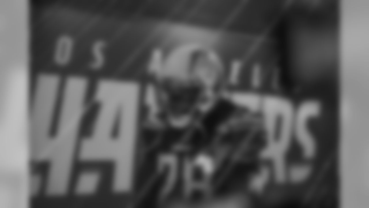 Melvin Gordon walks through the tunnel to take the field before the Week 11 matchup against the Denver Broncos.
