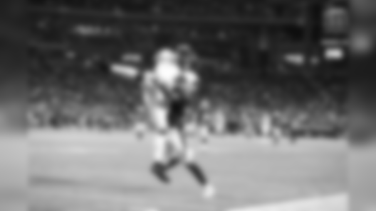 Geremy Davis makes a leaping catch before running in a touchdown during the Chargers' first preseason game versus the Arizona Cardinals.