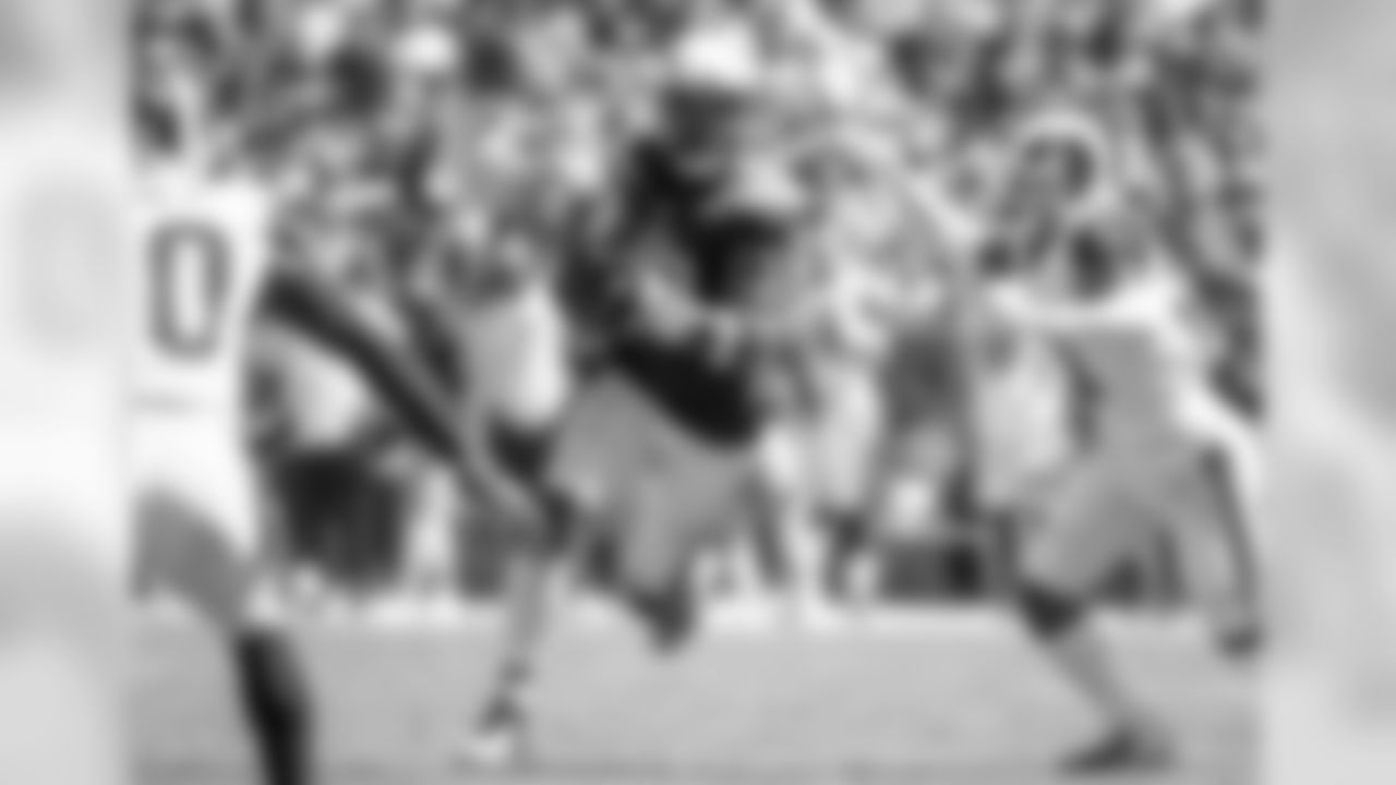 Keenan Allen carries the ball against the Los Angeles Rams at LA Memorial Coliseum on Sunday, September 23, 2018.