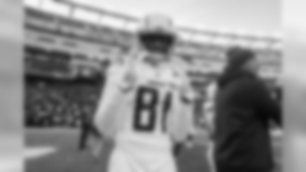 Mike Williams poses on the field before the Divisional Round matchup against the New England Patriots at Gillette Stadium.