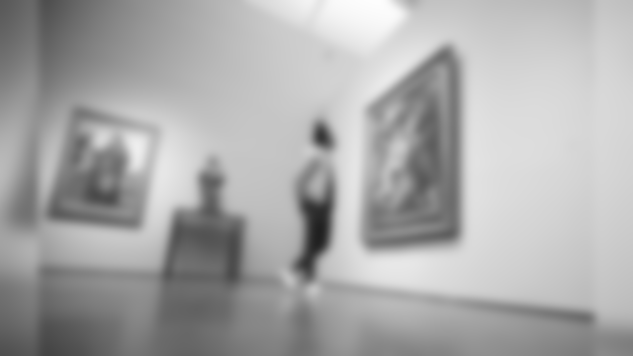 LA Chargers CB Michael Davis observes a painting from the LACMA exhibition, "To Rome and Back: Individualism and Authority in Art, 1500-1800." The collection focuses on the depth of Rome's impact from the Renaissance to the Enlightenment.