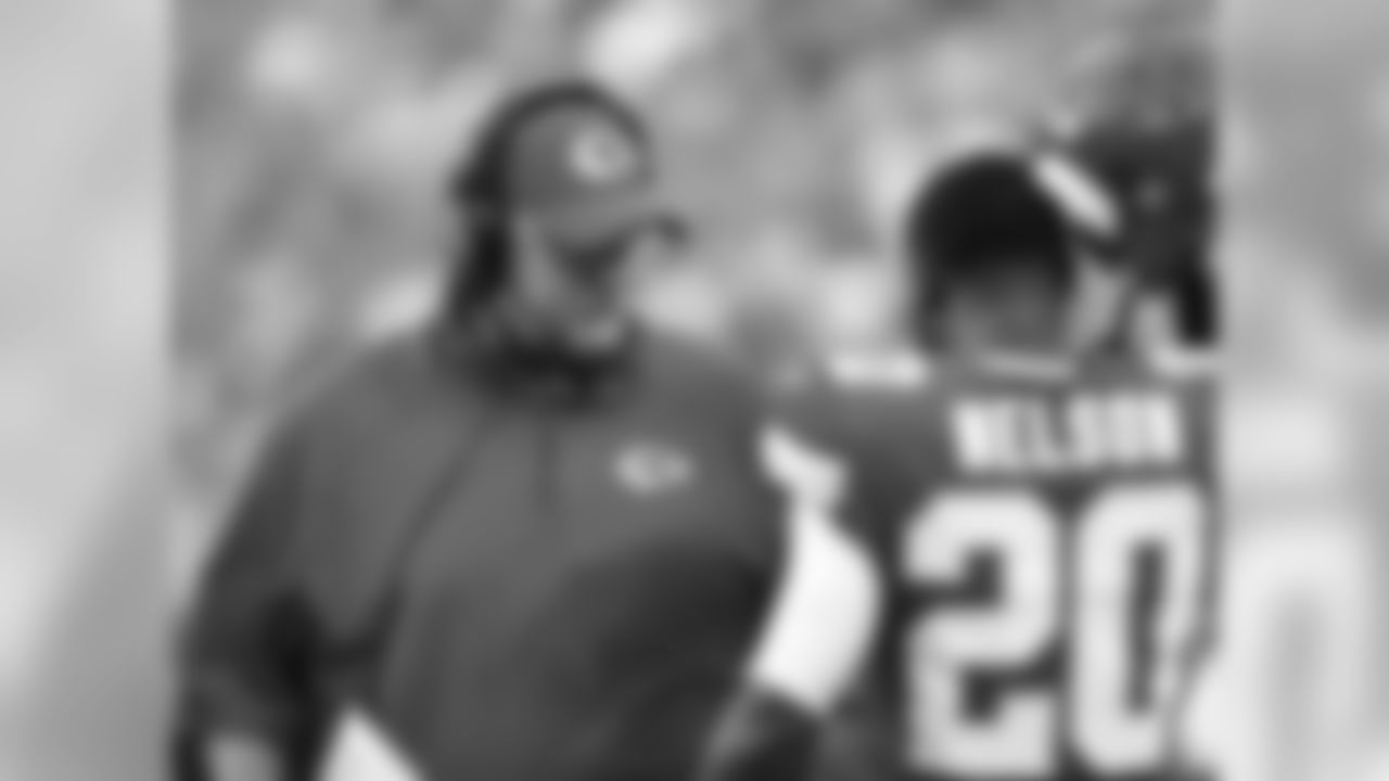 Andy Reid talks to Kansas City Chiefs cornerback Steven Nelson (20) during Texans at Chiefs at Arrowhead Stadium on 8/9/18.