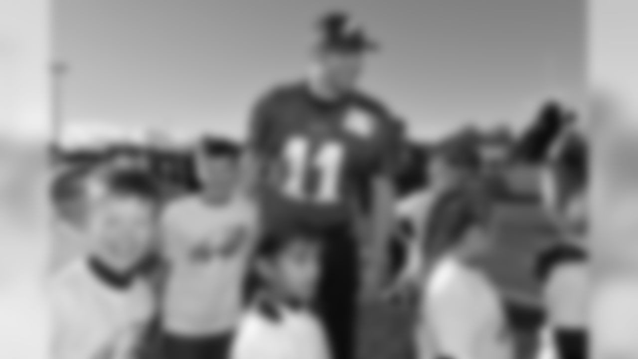 QB Carson Wentz having a laugh with the children