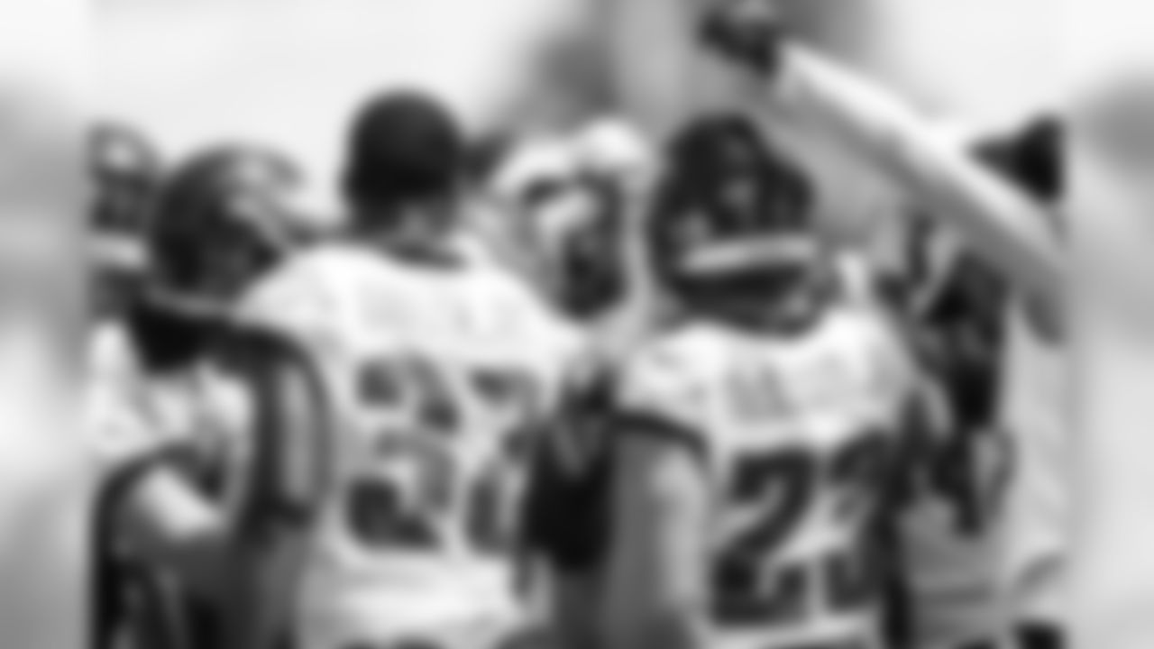 The Eagles defensive backs huddle up.