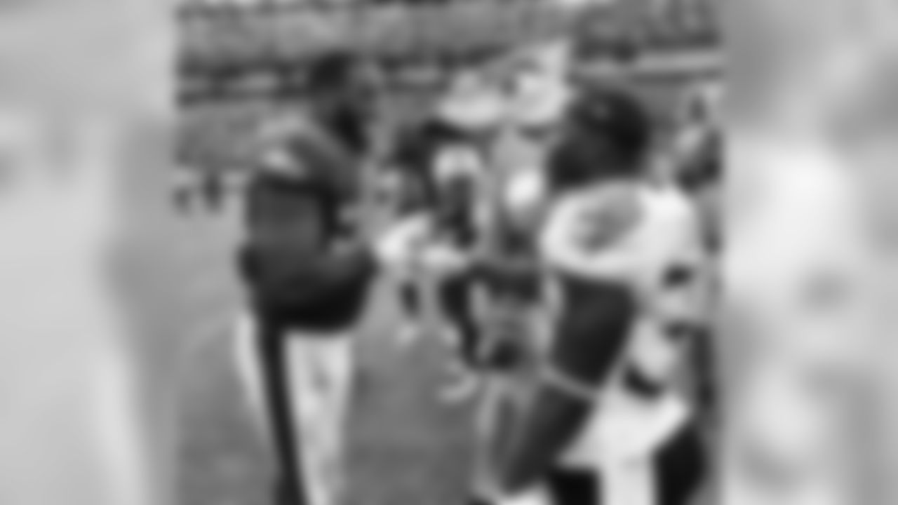 DE Brandon Graham and Titans RB Dion Lewis