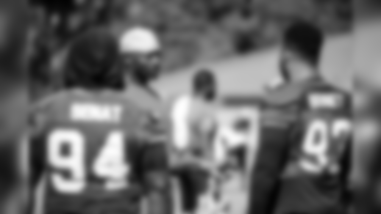 Bryant Young, defensive line coach, DT Deadrin Senat and DT Michael Bennett