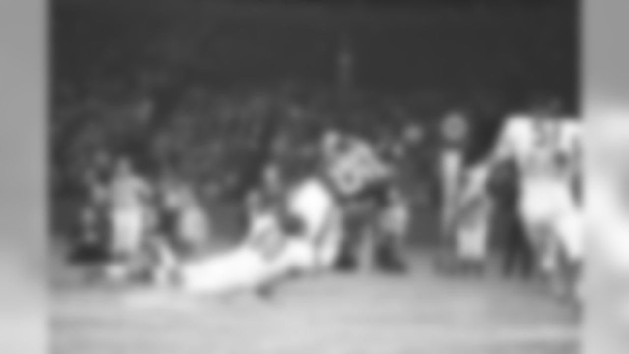 Wide receiver Don Hermann (85) of the New York Giants is pulled down by linebacker Lee Roy Caffey (60) of the Chicago Bears in first quarter action in New York, Sept. 19, 1970. The Bears won, 24-13. (AP Photo/Ron Frehm)