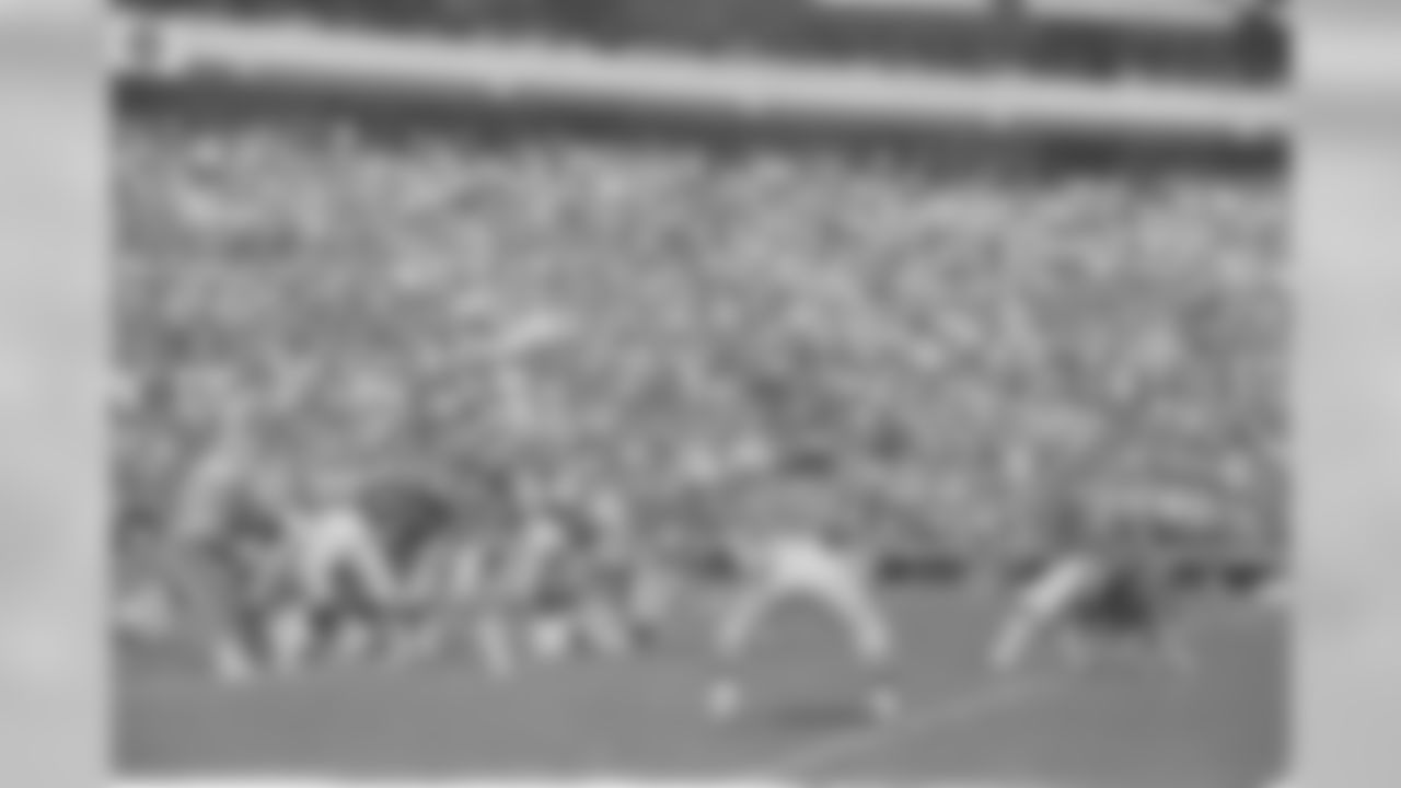 New York Giants kicker Ali Haji-Sheikh (6) puts the winning 3 points on the scoreboard as quarterback Scott Brunner (12) holds the ball with a 30-yard field goal in overtime to beat the Atlanta Falcons, 16-13, Sept. 11, 1983. (AP Photo/Charles Kelly)