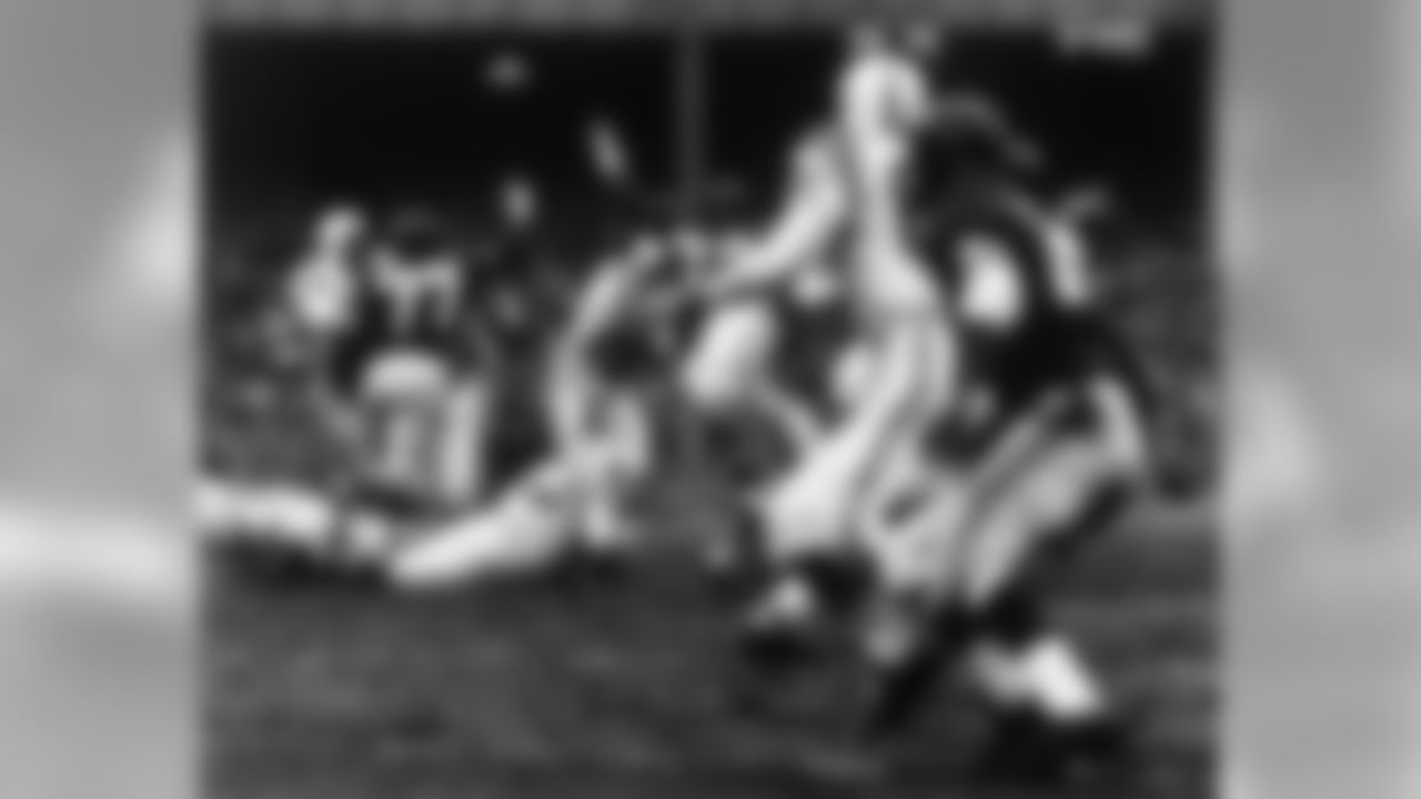 Baltimore Colts Hall of Fame quarterback Johhny Unitas (19) throws to end Raymond Berry (82) in a 23 to 17 Baltimore Colts overtime win over the New York Giants in the 1958 NFL Championship game played at Yankee Stadium on Dec. 28, 1958 in Bronx, New York. (AP Photo/NFL Photos)
